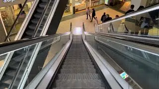 Glasgow, Scotland. 3x O&K Escalator down ride outside Boots in Buchanan Galleries Shopping mall