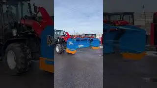 Snowfire Snow Plow & Pusher System on a Manitou Wheel Loader