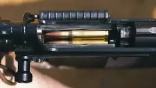 FAL rifle in action without the dust cover.