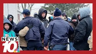 Prison guards working at Attica embrace guards still on strike