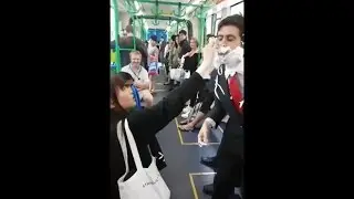 Man in Business suit in Melbourne City Shaving on the Tram EPIC