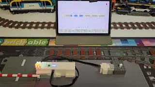 Lego motor switching train track and automated railway crossing