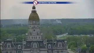 Jesse Walker spots housefire from tower cam at start of WAWV News at 5