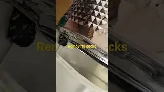 Removing socks stuck in a washing machine drum