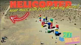 Helicopter nearly hit people and drone!