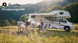 Multi-generation family unpacking and talking by car, caravan holiday trip. stock video