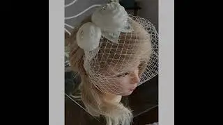 Hat veil on the headband decorated with roses and rhinestones