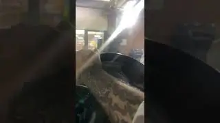 Guy breaks through glass door and is chased by guy with broom.