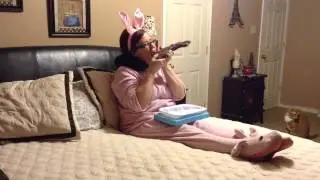Lady eats chocolate easter bunny