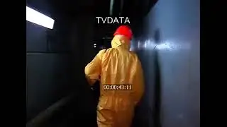 PPE HD Stock Video Man in Chemical Protective Suit with Respirator &mdash; Dosimeter Check (HD/4K)