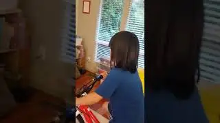 Raina riding in Zwift for the first time with a fluid bicycle trainer
