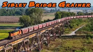 Sibley Railroad Bridge gets an eastbound grainer across the Missouri River on an early fall day