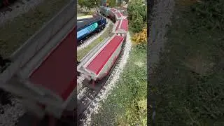 Crossing the country road a Bulleid Booster pulling CDA Hopper wagons.