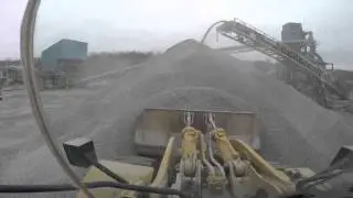 Caldwell Stone CAT 980H loading Mike Emerson Trucking