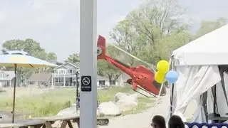 Helicopter crashes while trying to land outside Michigan restaurant on Lake St. Clair