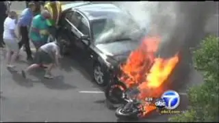 Bystanders Rescue Man from Under Burning Car