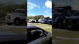 Trucks at a funeral in Exuma The Bahamas