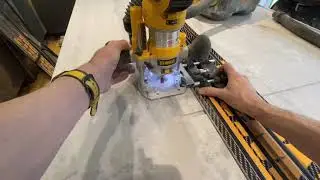 DeWalt DCW604 cordless router with guide rail 2