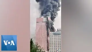 Fire Engulfs Skyscraper in Southern China