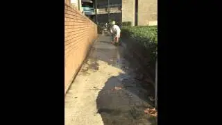 Pressure Washing concrete footpaths, power rinse.