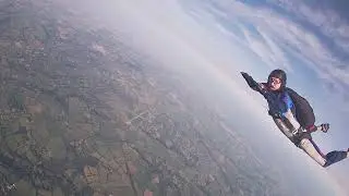 FS Jump with Lucy. Unlinked outside exit, fast slow fall, pass. Dunkeswell. Sept 2022. (Jump 55).