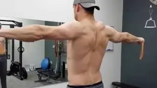 Pulse Personal Training client Justin Walley performs a band pull apart