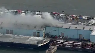 Wind-whipped aire burns through 8 bays of large warehouse on Red Hook Piers