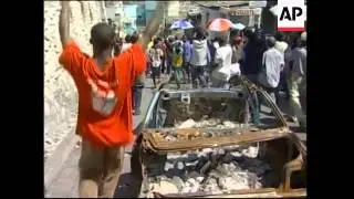 Aristide supporters march, presidential meeting