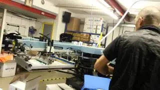 Unloading the shirts automatic screen printing mac