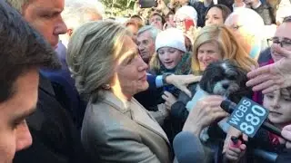 Hillary Clinton greets supporters after casting her vote
