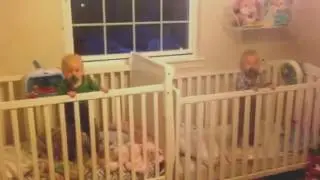 Exhausted twins fall asleep simultaneously.