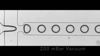 Microfluidic droplet generation using vacuum control