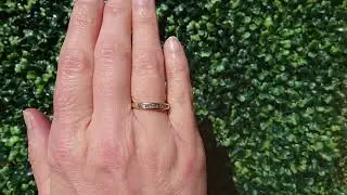 An 18 carat gold half hoop diamond eternity ring