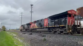 CN 3166 Tugs a 69 Car M383 by Fraser