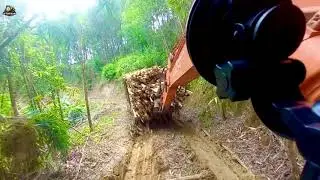 Specialized excavator transporting acacia wood on rugged mountainous terrain #Excavator #Logging