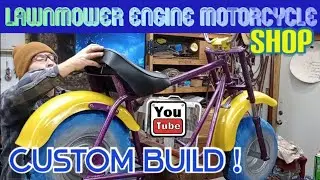 lawnmower engine motorcycle shop.clean and regressed bearings,mount freshly painted wheels
