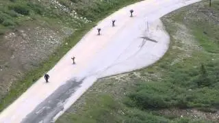 skate boards down a mountain