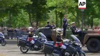 Macron in parade along Champs Elysee