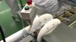 柿の葉包装機反転機付き