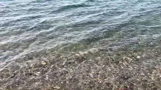 The waves are a little rough on the shore in early spring 2   4K