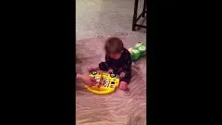 Carson Reikofski playing with learning toy