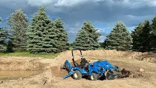 Pond dig with a sub compact tractor