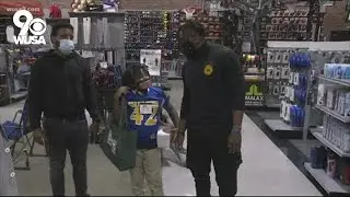 WFT player Landon Collins takes DC kids on a shopping spree