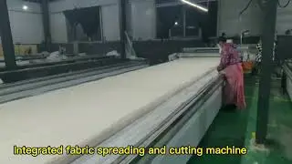 Integrated fabric spreading and cutting machine