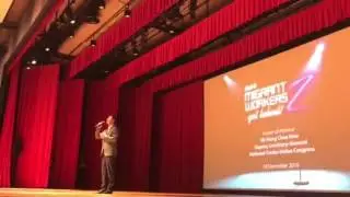 Mr Shao Yong Jun singing in a talent show for migrant workers