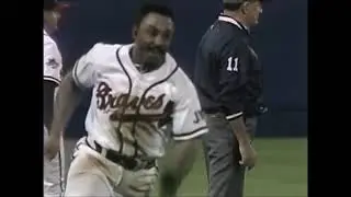 Catcher Brian Harper (MIN) holds onto the ball after Lonnie Smith (ATL) barrels into him (Game 4)
