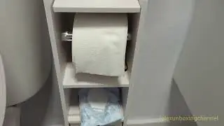 Showing the AOJEZOR Toilet Paper Holder Stand for bathroom with Storage Cabinet, from Amazon.