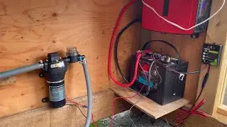 Solar powered greenhouse water and fan system.