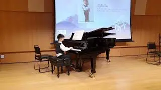 Aiden Er performing dance of the sugar plum fairy on piano at Seimpi's classical extravaganza