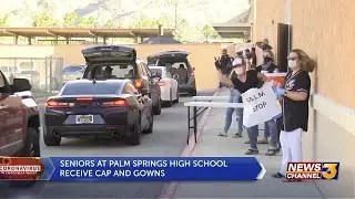 Palm Springs High School seniors pick up caps & gowns